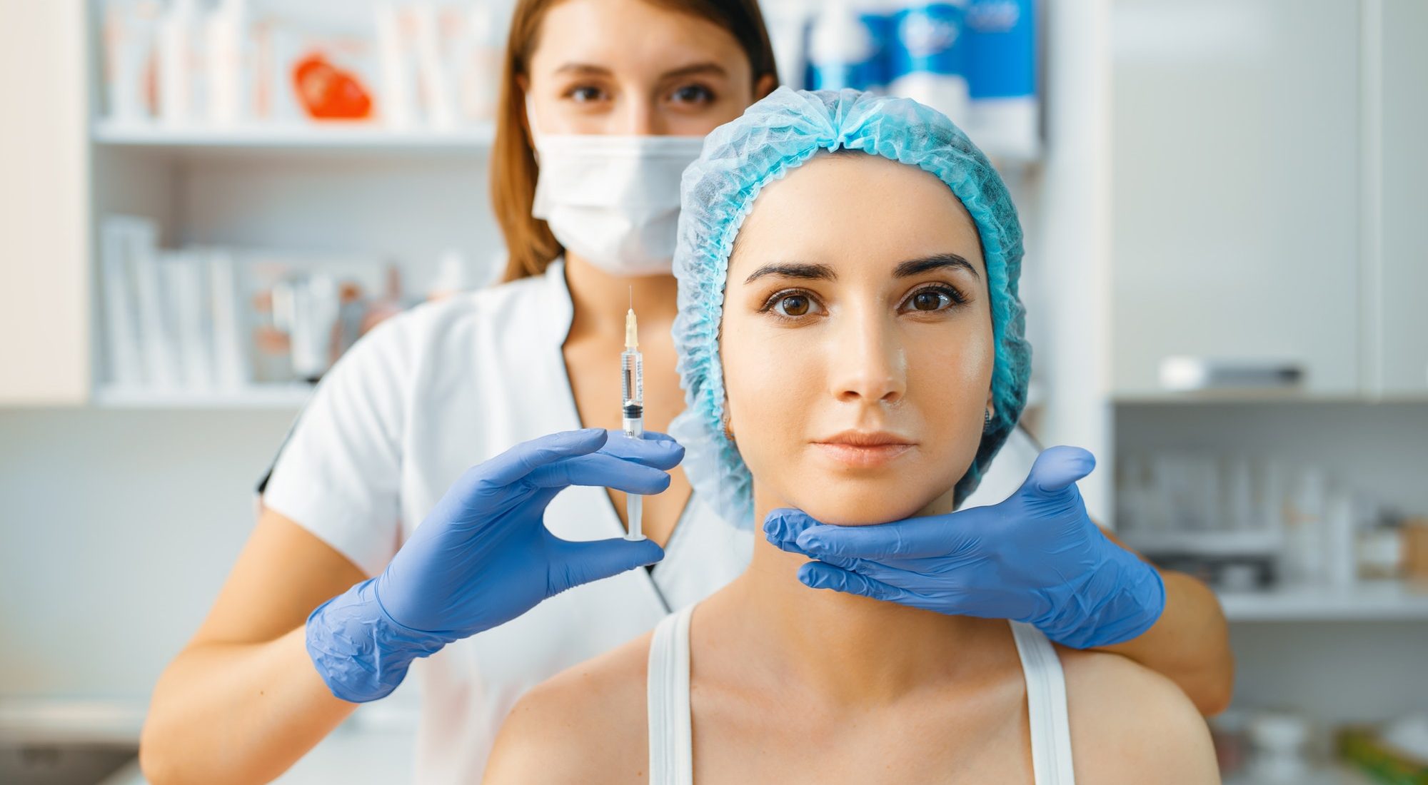 cosmetician-holds-syringe-with-injection-of-botox.jpg